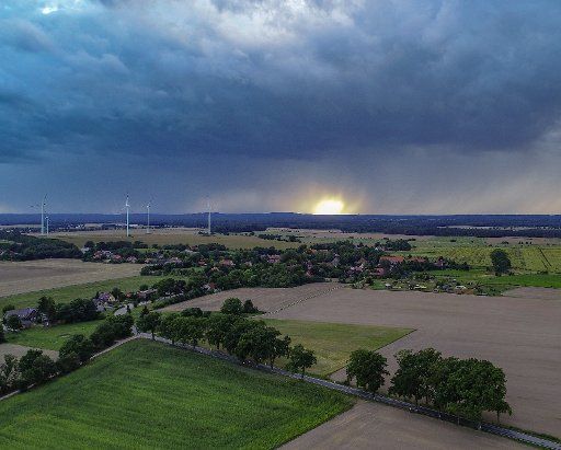 18 August 2019, Brandenburg, Sieversdorf: Dark clouds of rain move over the landscape in the Oder-Spree district (aerial photograph with a drone). Photo: Patrick Pleul\/dpa-Zentralbild\/