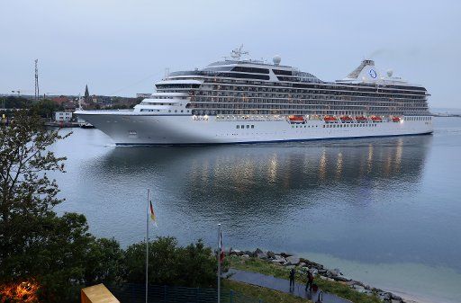 12 July 2019, Mecklenburg-Western Pomerania, Rostock: As the first of five expected cruise ships, the "Marina" will enter the sea channel in Warnemünde early in the morning. Three luxury liners will moor in Warnemünde for the only five-times start of the 2019 season, two will be in the Rostock seaport. A total of 199 calls by 41 different ships are on the cruise calendar this season. Photo: Bernd Wüstneck\/dpa-Zentralbild\/