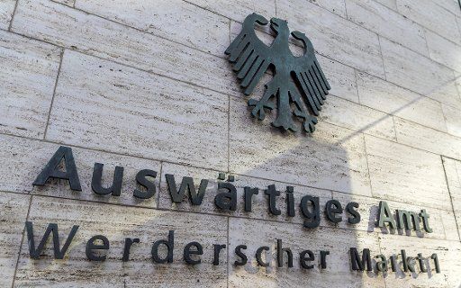18 October 2019, Berlin: The German coat of arms and the lettering "Auswärtiges Amt \/ Werderscher Markt 1" are attached to an outer wall at the entrance to the Foreign Office. Photo: Monika Skolimowska\/dpa-Zentralbild\/