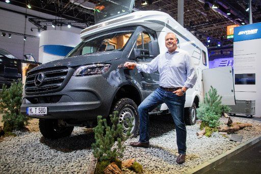 29 August 2019, North Rhine-Westphalia, Duesseldorf: Bob Martin, Managing Director of motorhome and caravan manufacturer Thor, stands in front of a Hymer vehicle in front of a dpa interview in the run-up to the Caravan Salon on the exhibition grounds. The US motorhome and caravan manufacturer Thor bought the Baden-Württemberg company Hymer in February. Photo: Rolf Vennenbernd\/