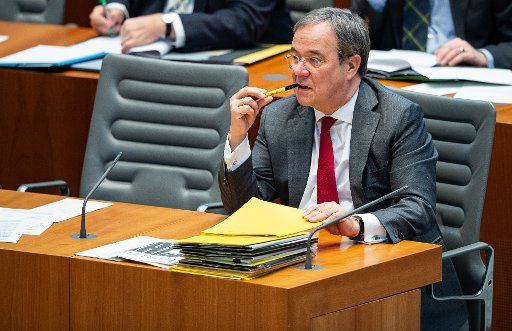 27 November 2019, North Rhine-Westphalia, Duesseldorf: Armin Laschet (CDU), Prime Minister of North Rhine-Westphalia, sits in the state parliament at the session of the North Rhine-Westphalian state parliament on the 2020 budget. The 80 billion euro budget is to be approved before the Christmas break. Photo: Guido Kirchner\/