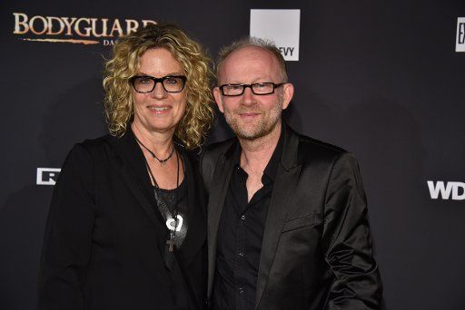 24 October 2019, North Rhine-Westphalia, Cologne: Music producer Prof Dieter Falk with his wife Angelika comes to the premiere and tour start of the musical BODYGUARD in the Musical Dome Photo: Horst Galuschka\/