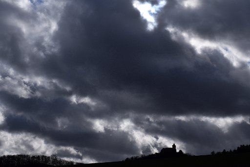11 February 2020, Thuringia, Holzhausen: Strong wind drives dark clouds in the sky above the Wachsenburg. After the stormy start of the week due to hurricane "Sabine", the weather in Germany will remain mostly changeable and uncomfortable in the coming days. Photo: Martin Schutt\/dpa-Zentralbild\/