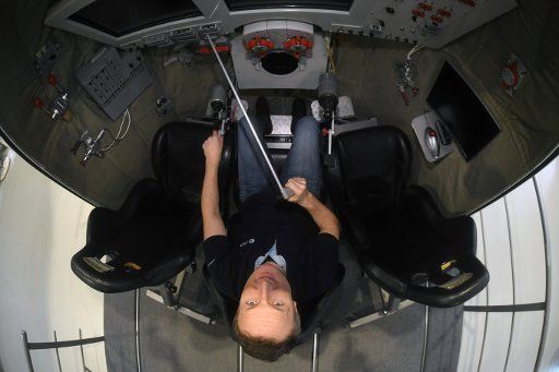 10 December 2019, North Rhine-Westphalia, Cologne: Astronaut Matthias Maurer sits in a training module of a Soyuz capsule at the European Astronaut Centre (EAC) on the ESA premises. Photo: Felix Hörhager\/