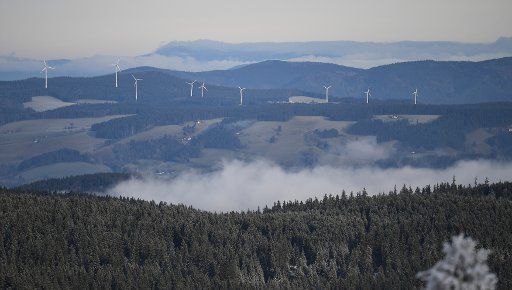 26 December 2019, Baden-Wuerttemberg, Feldberg Im Schwarzwald: Windmills stand on the peaks of a mountain ridge. Photo: Patrick Seeger\/
