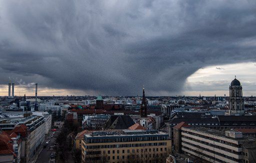 01 March 2020, Berlin: A dark cloud wall hangs over the city. On the right you can see the Old Town House. Photo: Paul Zinken\/