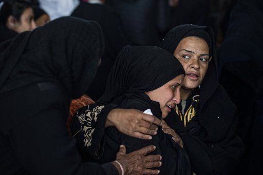 14 March 2020, Egypt, Cairo: Mourners grieve at the St. Mark and St. Shenouda Church, during the funeral of five victims who drowned at Al Zarayeb area after their homes were submerged with water, amid turbulent weather conditions. At least 20 people died in accidents linked to Egypt\