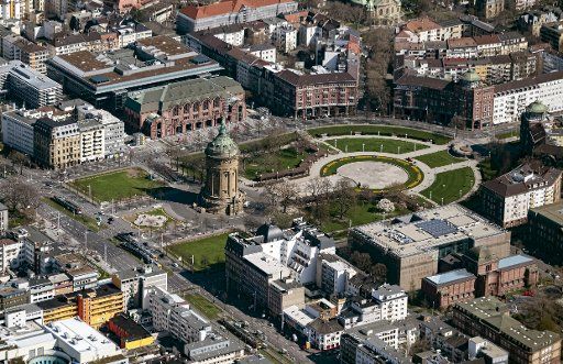 26 March 2020, Baden-Wuerttemberg, Mannheim: Aerial view, taken from an airplane, of the city center of Mannheim with the water tower. Photo: Uli Deck\/