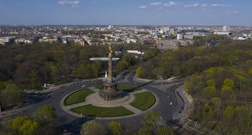 12 April 2020, Berlin: An almost cloudless sky can be seen above the Victory Column. (aerial view with drone) Photo: Paul Zinken\/dpa-zb-Zentralbild\/