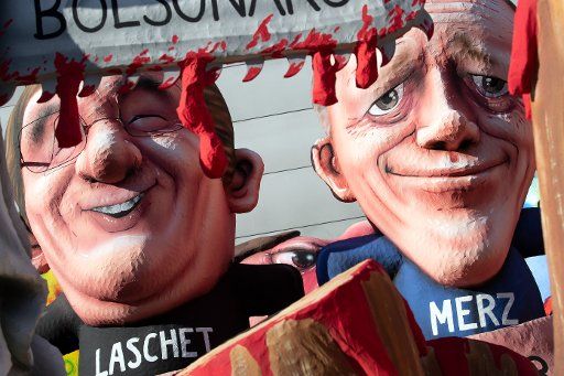 25 February 2020, North Rhine-Westphalia, Duesseldorf: A carnival float with figures by Armin Laschet (CDU, l), Prime Minister of North Rhine-Westphalia, and Friedrich Merz (CDU), former Union faction leader in the Bundestag, stands in a courtyard of the train control. Photo: Federico Gambarini\/