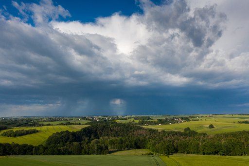 02 June 2020, Saxony, Göhren: A rain front moves over central axes. (aerial photo with drone) Photo: Jan Woitas\/dpa-Zentralbild\/
