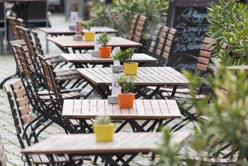 05 June 2020, Saxony, Dresden: Empty tables stand on the Neumarkt in front of a restaurant. Under strict hygienic conditions, restaurants in the Free State have been allowed to reopen since 15 May. Photo: Robert Michael\/dpa-Zentralbild\/