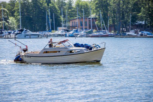 10 June 2020, Mecklenburg-Western Pomerania, Schwerin: A motorboat is sailing on the Schwerin lake. Photo: Jens Büttner\/dpa-Zentralbild