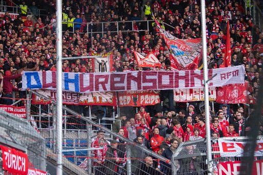 FILED - 29 February 2020, Baden-Wuerttemberg, Sinsheim: Football: Bundesliga, 24th matchday, 1899 Hoffenheim - Bayern Munich, PreZero Arena. Fans of FC Bayern Munich hold a banner with the inscription "You son of a bitch!" against D. Hopp, patron of TSG 1899 Hoffenheim. (to dpa "Minister Strobl: Check personalized tickets in professional football" Photo: Tom Weller\/dpa - IMPORTANT NOTE: In accordance with the regulations of the DFL Deutsche Fußball Liga and the DFB Deutscher Fußball-Bund, it is prohibited to exploit or have exploited in the stadium and\/or from the game taken photographs in the form of sequence images and\/or video-like photo series