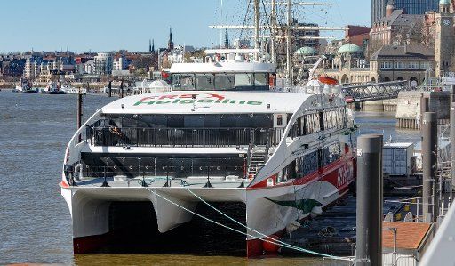 22 March 2020, Hamburg: The high-speed ferry Halunder Jet is moored at its berth. At the moment her ferry service to Helgoland is stopped as a measure to fight the coronavirus. Photo: Markus Scholz\/
