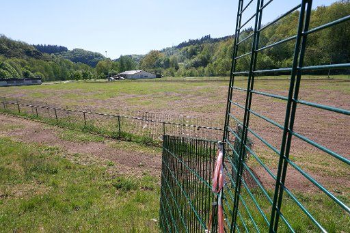 06 May 2020, Rhineland-Palatinate, Frauenberg: A temporary protective fence is to prevent the FC Lauretta sports field from being dug up even further by wild boars. Wild boars are multiplying more and more due to climate change and are devastating not only gardens but also sports fields - soccer will be a thing of the past. (to dpa "Wild boars devastate sports fields") Photo: Thomas Frey\/