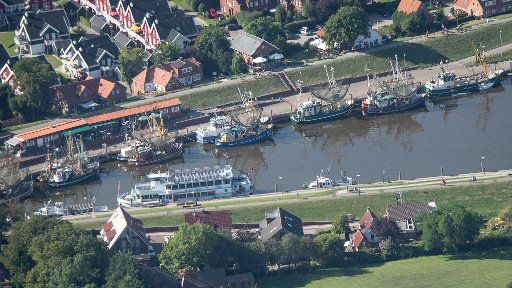 07 August 2020, Lower Saxony, Greetsiel: Crab boats are moored in the historic harbour of Greetsiel. Photo: Sina Schuldt\/dpa