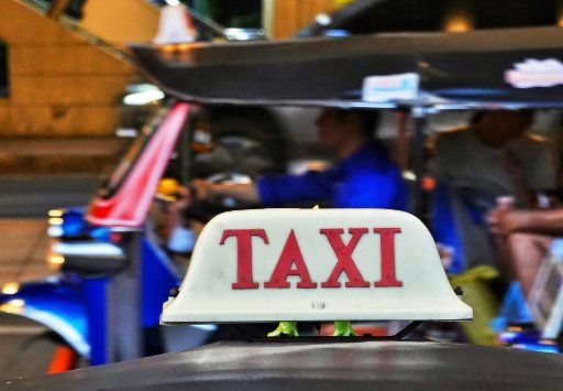 21 October 2019, Thailand, Bangkok: A taxi sign on a car. Photo: Soeren Stache\/dpa-Zentralbild