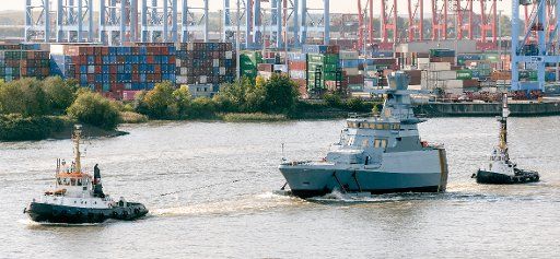 13 October 2020, Hamburg: The forecastle of the 7th boat of the corvette K130 class (also called Braunschweig class after the type ship), built at the Lürssen shipyard in Bremen, is sailing on the Elbe, moved by two tugs, in the direction of Blohm+Voss shipyard. Photo: Markus Scholz\/dpa