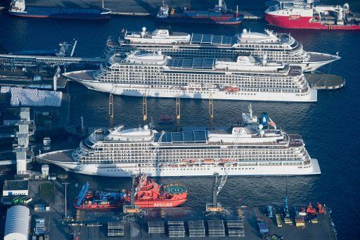 19 December 2020, Mecklenburg-Western Pomerania, Sassnitz-Mukran: The cruise ships "Viking Sky", "Viking Sun" and "Viking Star" are moored at a quay in the port of Mukran on the island of Rügen. As there are currently no cruise trips due to the Corona pandemic, the ships are moored in the port of the municipality of Sassnitz. The ships are each 228 meters long with a capacity of more than 900 passengers. Photo: Stefan Sauer\/dpa-Zentralbild\/dpa