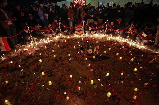02 January 2021, Iraq, Baghdad: People commemorate the one-year anniversary of the death of Iranian military commander and head of it\