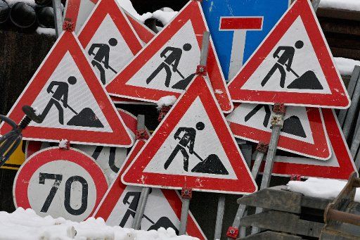 04 January 2021, Bavaria, Agatharied: Several construction site signs and other traffic signs stand next to each other in the yard of a road construction company. Photo: Peter Kneffel\/dpa