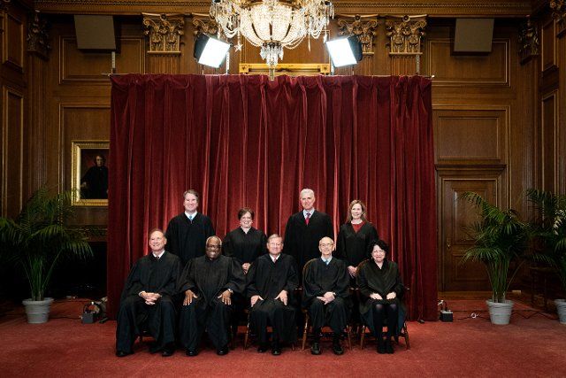Members of the Supreme Court pose for a group photo at the Supreme Court in Washington, DC on April 23, 2021. Seated from left: Associate Justice of the Supreme Court Samuel A. Alito, Jr., Associate Justice of the Supreme Court Clarence Thomas, Chief Justice of the United States John G. Roberts, Jr., Associate Justice of the Supreme Court Stephen G. Breyer, and Associate Justice of the Supreme Court Sonia Sotomayor, Standing from left: Associate Justice of the Supreme Court Brett Kavanaugh, Associate Justice of the Supreme Court Elena Kagan, Associate Justice of the Supreme Court Neil M. Gorsuch and Associate Justice of the Supreme Court Amy Coney Barrett. Credit: Erin Schaff \/ Pool via CNP | usage worldwide