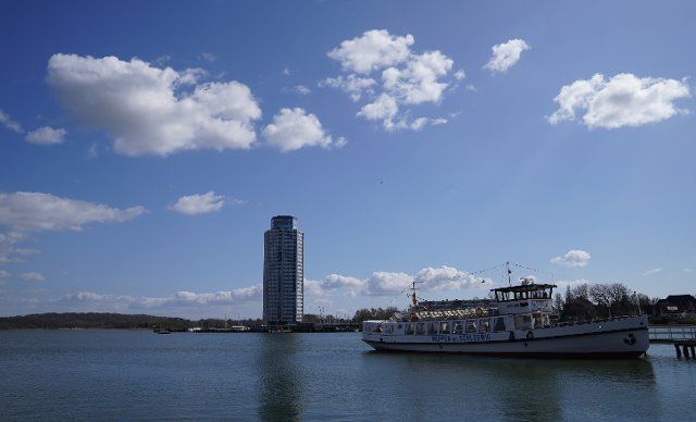 23 April 2021, Schleswig-Holstein, Schleswig: The liner and excursion ship "Wappen von Schleswig" lies on the Schlei at a jetty. In the background you can see the Viking Tower. Photo: Marcus Brandt\/dpa