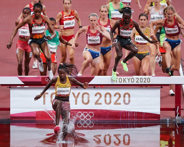 04 August 2021, Japan, Tokio: Athletics: Olympics, 3000m steeplechase, women, at the Olympic Stadium. Peruth Chemutai from Uganda leads the field. Photo: Jan Woitas\/dpa
