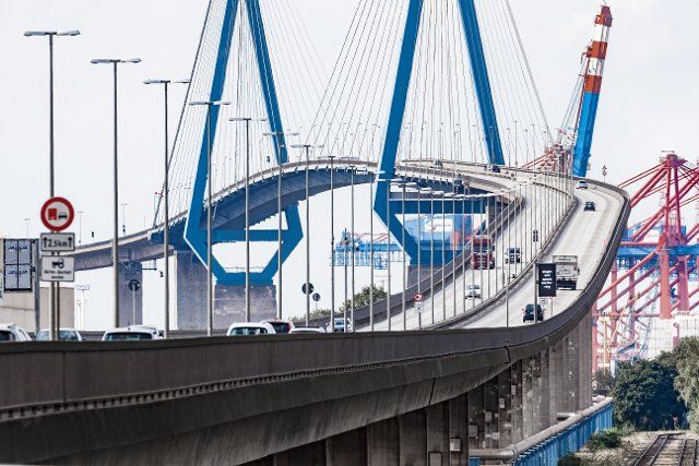 02 October 2021, Hamburg: Cars drive over the KÃ¶hlbrand Bridge in the Port of Hamburg. For structural reasons, it is being replaced by a tunnel, which is scheduled for completion by 2034. Photo: Markus Scholz\/dpa