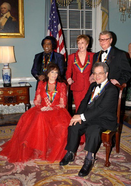 The 2003 Kennedy Center Honors recipients pose for a group photo after a dinner at the United States State State Department hosted by United States Secretary of State Colin Powell in Washington, DC on December 6, 2003. Honorees, clockwise from foreground left are singer Loretta Lynn, singer James Brown, comedian Carol Burnett, director Mike Nichols, and violinist Itzhak Perlman...Credit: Robert Trippett - Pool via CNP