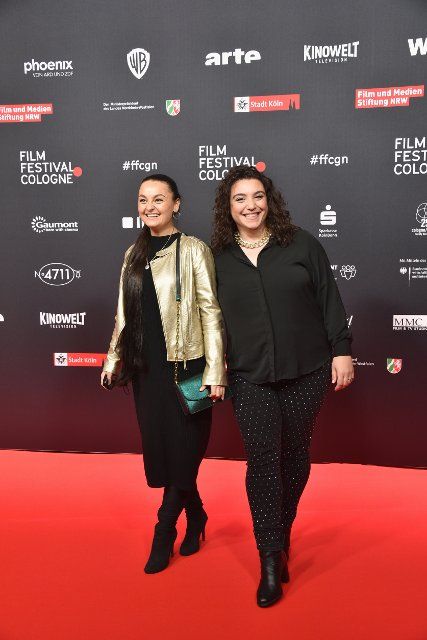 21 October 2021, North Rhine-Westphalia, Cologne: Actress Taisiya Schumacher and Nuriye Jendrossek (r) arrive at the opening of the Film Festival Cologne 2021 which starts with the German premiere of the series highlight FURIA. Photo: Horst Galuschka\/dpa
