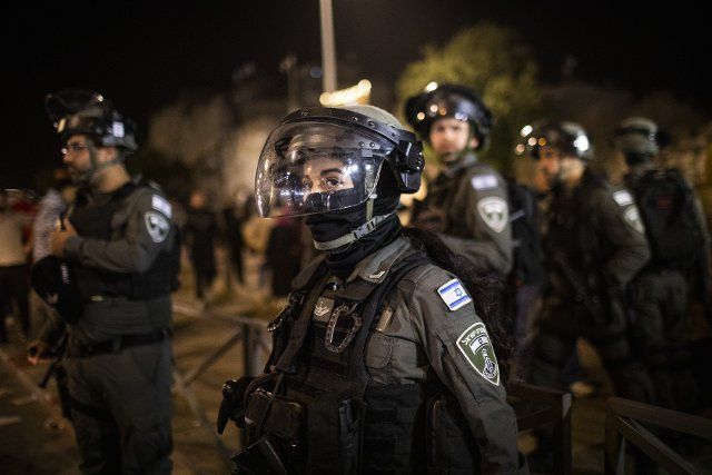 06 April 2022, Palestinian Territories, Jerusalem: An Israeli security forces member stands guard during clashes with Palestinian protesters at Damascus Gate by the entrance to Jerusalem\