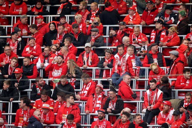 20 April 2022, Saxony, Leipzig: Soccer: DFB Cup, RB Leipzig - 1. FC Union Berlin, semifinal, Red Bull Arena. Fans of Union Berlin are seated in the stands. IMPORTANT NOTE: In accordance with the requirements of the DFL Deutsche Fußball Liga and the DFB Deutscher Fußball-Bund, it is prohibited to use or have used photographs taken in the stadium and\/or of the match in the form of sequence pictures and\/or video-like photo series. Photo: Jan Woitas\/dpa