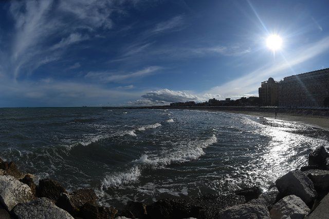 24 April 2022, Italy, Venedig: Blue sky and clouds with sunshine can be seen over the beach of the Lido. After the Venice Art Biennale began with rain, the weather has changed for the better today. Photo: Felix Hörhager\/dpa