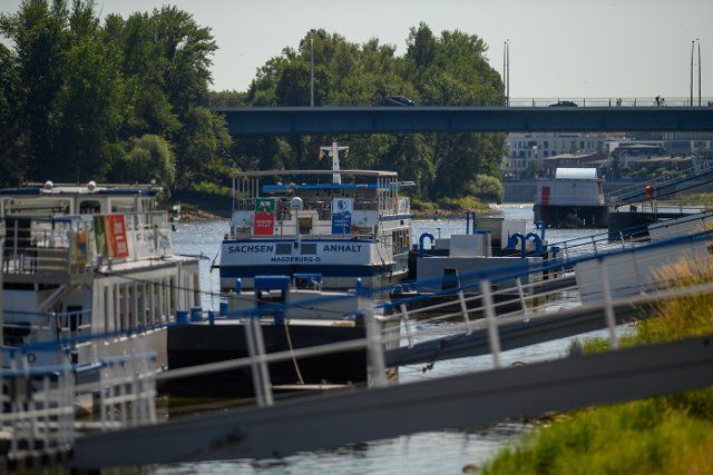 23 June 2022, Saxony-Anhalt, Magdeburg: Excursion ships of the White Fleet are moored on the banks of the Elbe. Due to the low water level of the Elbe, the Magdeburg White Fleet has partially suspended navigation on the Elbe. Passenger shipping is affected. Photo: Klaus-Dietmar Gabbert\/dpa