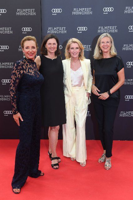 23 June 2022, Bavaria, Munich: Diana Iljine (l-r), director of Filmfest München, Ilse Aigner, president of the Bavarian parliament, actress Maria Furtwängler and Katja Wildermuth, artistic director of Bayerischer Rundfunk, arrive at the Isarphilharmonie for the film festival. The festival shows films from all over the world until July 2. Photo: Felix Hörhager\/dpa