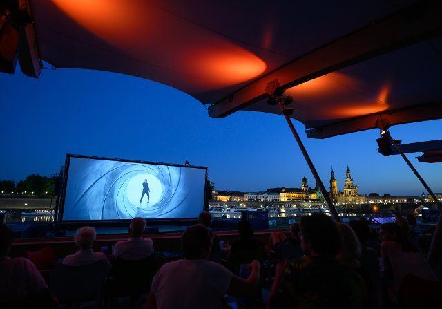 23 June 2022, Saxony, Dresden: Numerous guests sit in front of the backdrop of Dresden\