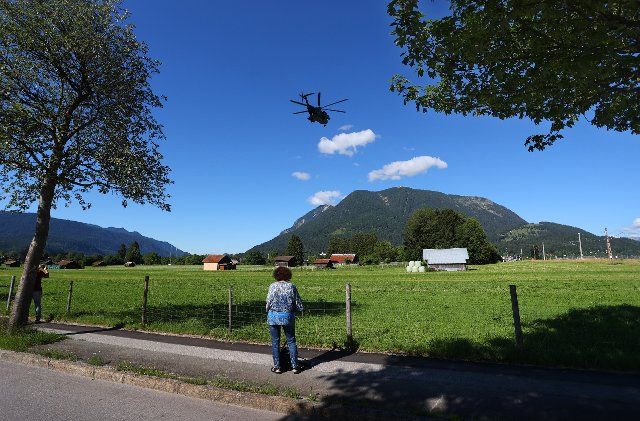 25 June 2022, Bavaria, Garmisch-Partenkirchen: A Bundeswehr helicopter flies in the blue sky near the media center. Germany is hosting the G7 summit (June 26-28) of economically strong democracies. Photo: Karl-Josef Hildenbrand\/dpa