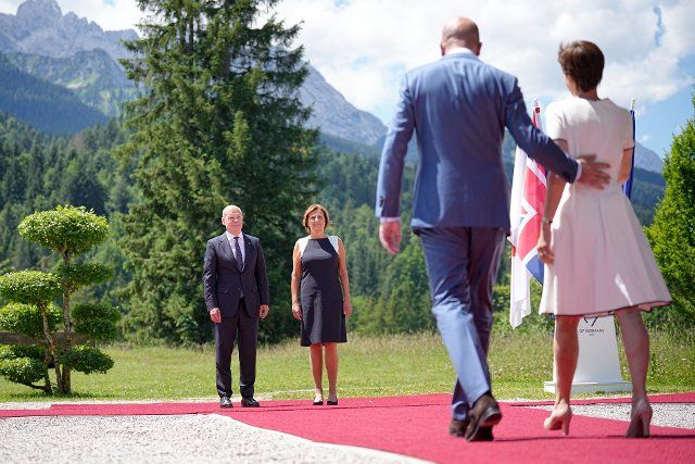 26 June 2022, Bavaria, Elmau: Charles Michel (2nd from right), President of the European Council, and Amelie Derbaudrenghien (r), partner of President Michel of the European Council, are welcomed by German Chancellor Olaf Scholz (l, SPD) to the G7 Summit at Schloss Elmau. Germany is hosting the G7 summit of economically strong democracies from June 26 to 28, 2022. On the first day of the summit, the global economic situation, climate protection and foreign and security policy with sanctions against Russia will be discussed. Photo: Michael Kappeler\/dpa