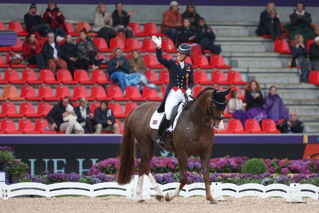 07 August 2022, Denmark, Herning: Equestrian sport: World Championship, Dressage, Grand Prix. Dressage rider Charlotte Dujardin (Great Britain) rides Imhotep and is happy after her ride. Photo: Friso Gentsch\/dpa
