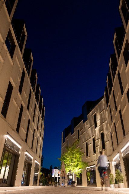 16 August 2022, Bavaria, Nuremberg: Dark blue is the evening sky at the blue hour above the buildings on the site "Augustinerhof". Photo: Daniel Karmann\/dpa