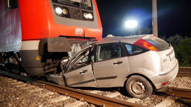 17 August 2022, Baden-Wuerttemberg, Bad Schussenried: A car jammed under a regional train. On Tuesday evening, a regional train collided with the car of a drunk man at a level crossing near Bad Schussenried (Biberach district). The 37-year-old motorist was stuck with his car on the tracks, but was able to get out in time and alerted the emergency services, according to police. Shortly thereafter, a regional train crashed into the vehicle. The man, the train\