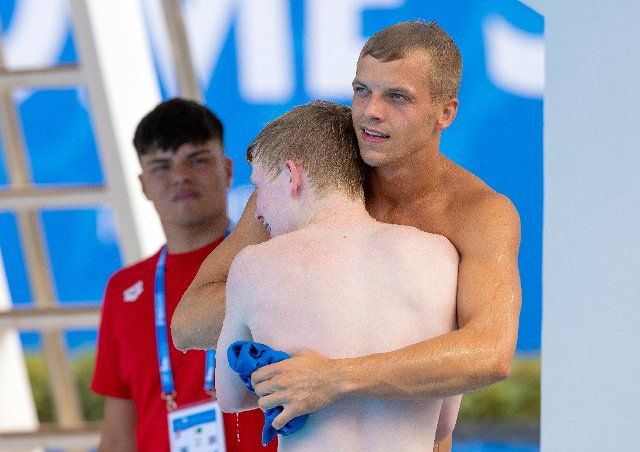 19 August 2022, Italy, Rom: Swimming\/Water diving: European Championships, synchronized diving 10 m, men, final: Timo Barthel (r) and Jaden Eikermann from Germany embrace. Photo: JoKleindl\/dpa