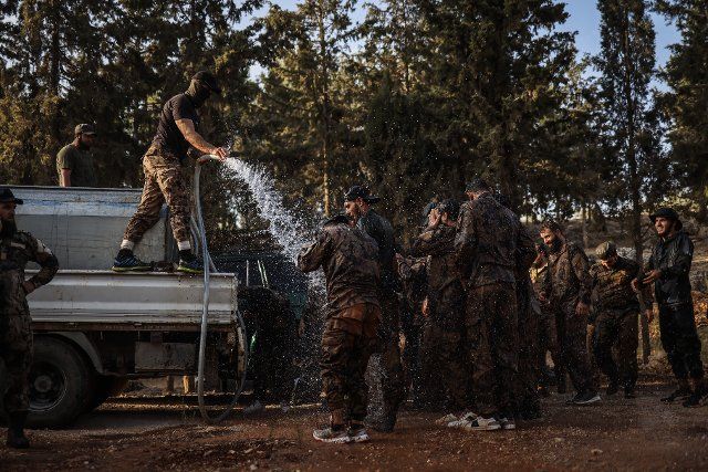 12 September 2022, Syria, Idlib: Armed opposition fighters of the Hay\