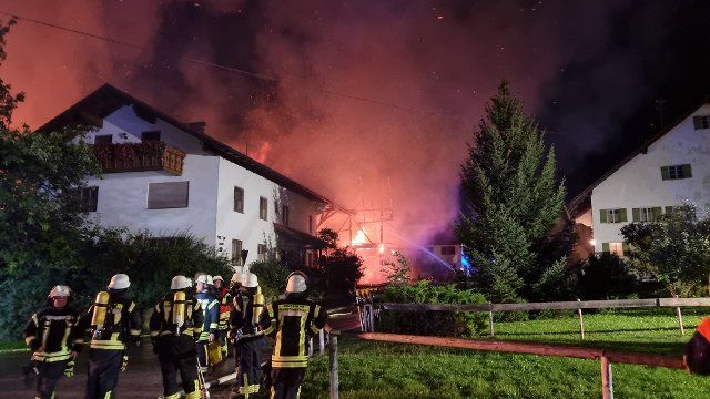 13 September 2022, Bavaria, Marktoberdorf: Firefighters are fighting a fire in two agricultural buildings. According to police, the damage amounted to about two to three million euros. One person was slightly injured. The cause of the fire was initially unclear. Photo: Lisa Willert\/dpa