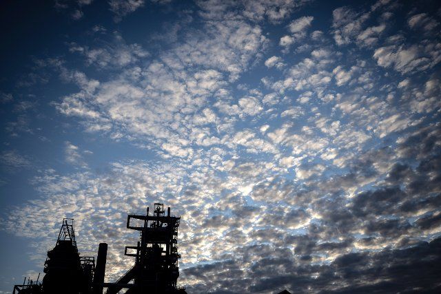 25 September 2022, North Rhine-Westphalia, Dortmund: Clouds can be seen in the morning hours in the sky above the industrial ruin of the former Phoenix West blast furnace plant. Photo: Bernd Thissen\/dpa