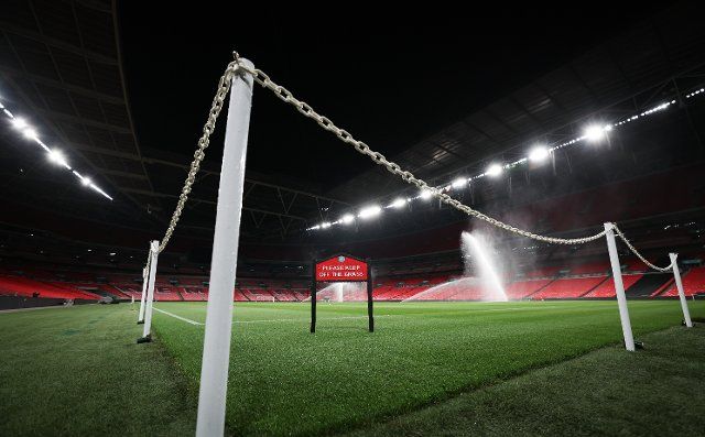 25 September 2022, Great Britain, London: Soccer: Nations League A, before the match England - Germany. The turf at Wembley Stadium is watered the night before the match. Photo: Christian Charisius\/dpa - IMPORTANT NOTE: In accordance with the requirements of the DFL Deutsche Fußball Liga and the DFB Deutscher Fußball-Bund, it is prohibited to use or have used photographs taken in the stadium and\/or of the match in the form of sequence pictures and\/or video-like photo series