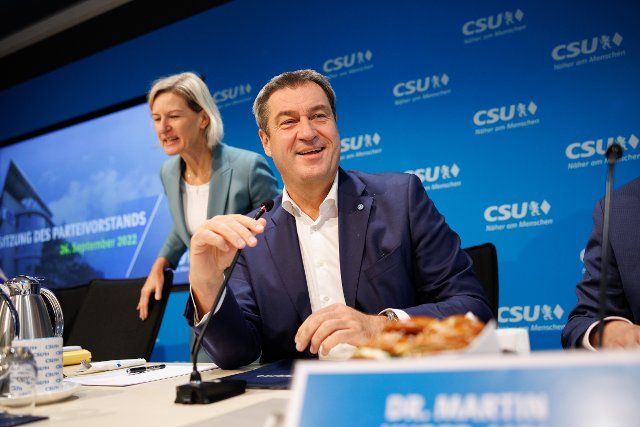 26 September 2022, Bavaria, Munich: Markus Söder (CSU, r), party chairman and prime minister of Bavaria, sits on the podium at the start of a meeting of the CSU executive committee. Next to him is Angelika Niebler, Deputy Chair of the CSU. Photo: Matthias Balk\/dpa