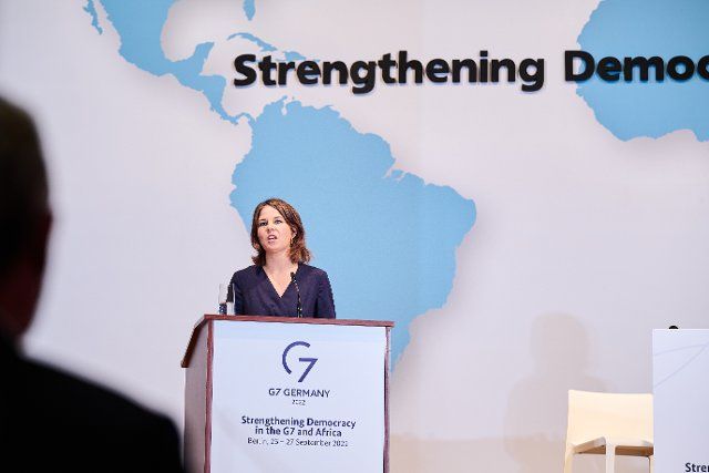26 September 2022, Berlin: Annalena Baerbock (Bündnis 90\/Die Grünen), Foreign Minister, speaks during the International Conference of the Federal Foreign Office "Strengthening Democracy - Towards Resilient Institutions and Societies in the G7 and Africa". The audience also includes Foreign Minister Botchwey of the Republic of Ghana and Nigerian human rights activist Ezekwesili, as well as members of think tanks and civil society and ambassadors from African countries. Photo: Annette Riedl\/dpa